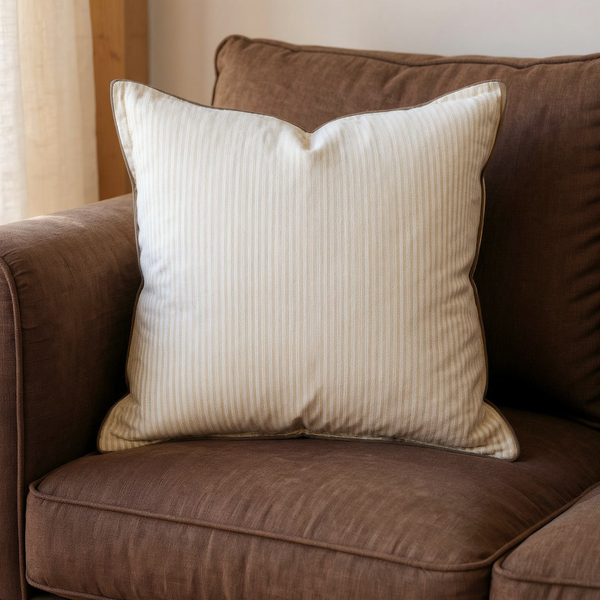 Reversible Cotton Stripe Throw Pillow in a close view on coordinated upholstered seating