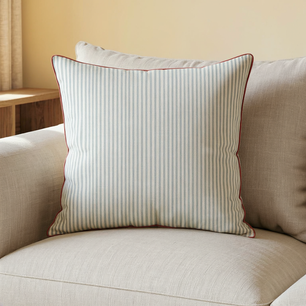 Reversible Striped Cotton Throw Pillow in a close view on coordinated upholstered seating