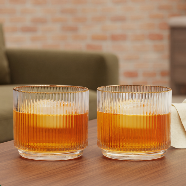 Ribbed Crystal Gold-Rim Tumbler Set styled in a warm editorial loft