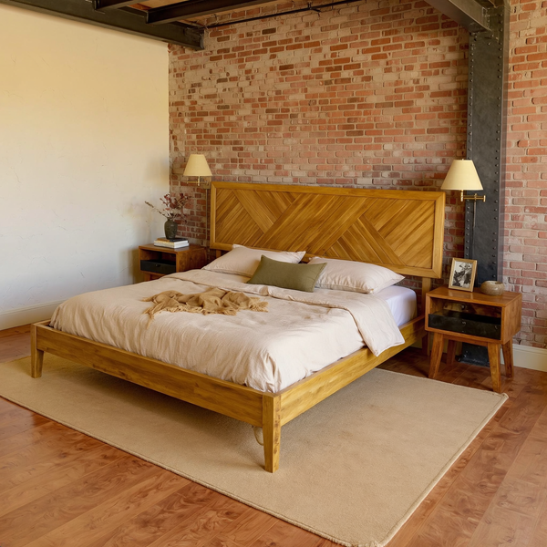 Chevron Parquet Solid Wood Bed Frame in a warm brick and steel loft bedroom with neutral bedding and a flat rug.