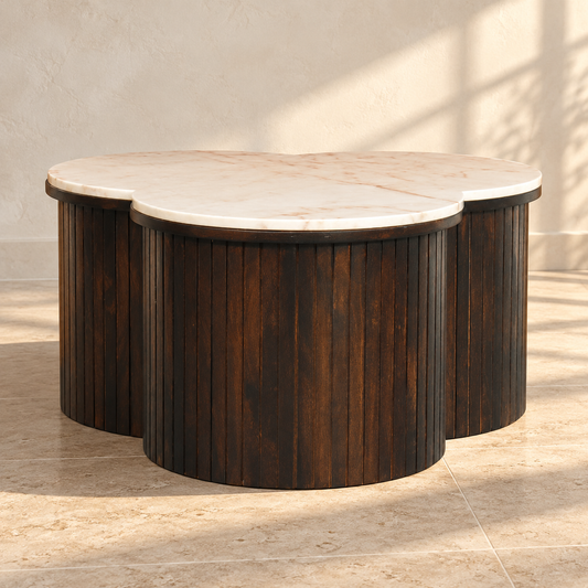 Fluted Mango Wood Marble-Top Coffee Table against a cream limewash wall on a travertine floor in warm afternoon light