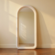 Arched Flannel-Frame Freestanding Floor Mirror against cream limewash with a softly reflected room