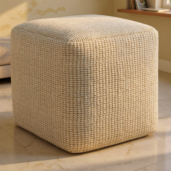 Square Woven PET Fiber Outdoor Pouf on a travertine floor in a sunlit room with cream limewash walls