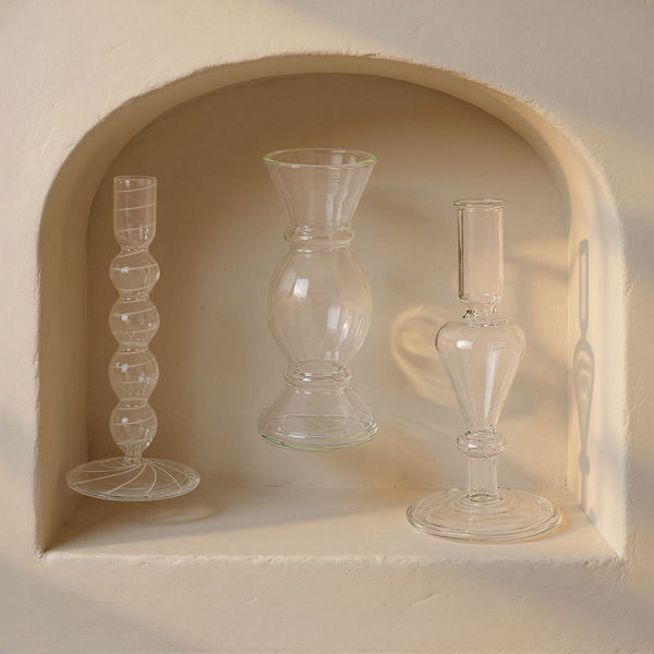 Etched Borosilicate Glass Bud Vases, Set of 3 in a cream plaster niche with warm natural side light