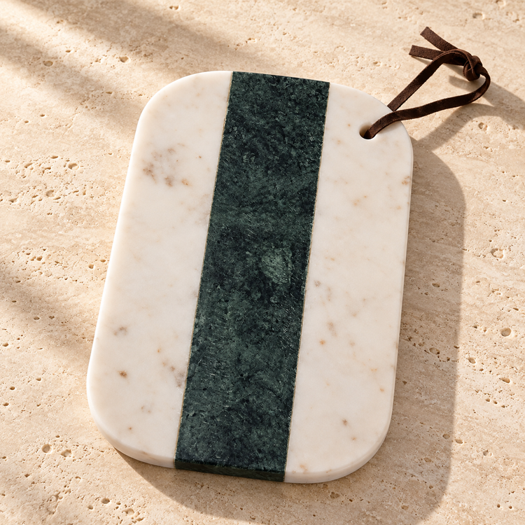 Green & White Marble Cheese Board on a sunlit pale travertine counter