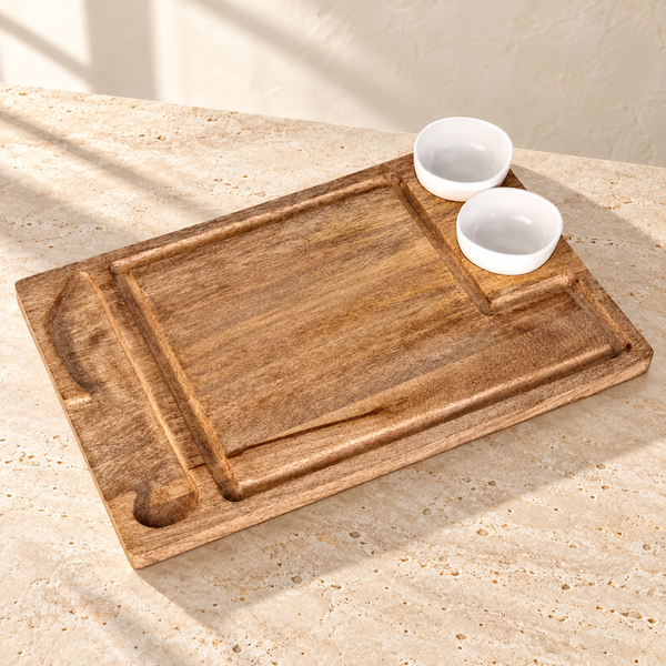 Mango Wood Serving and Cutting Board on a sunlit pale travertine counter