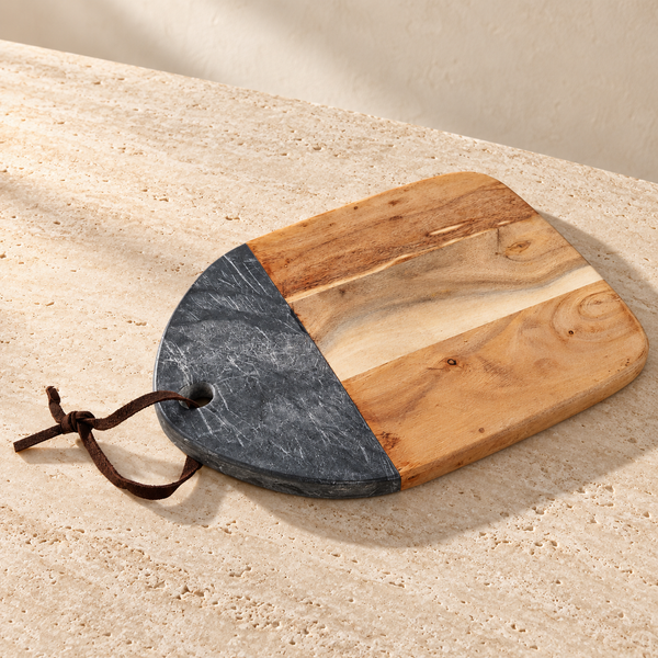 Marble Acacia Wood Serving Board on a sunlit pale travertine counter