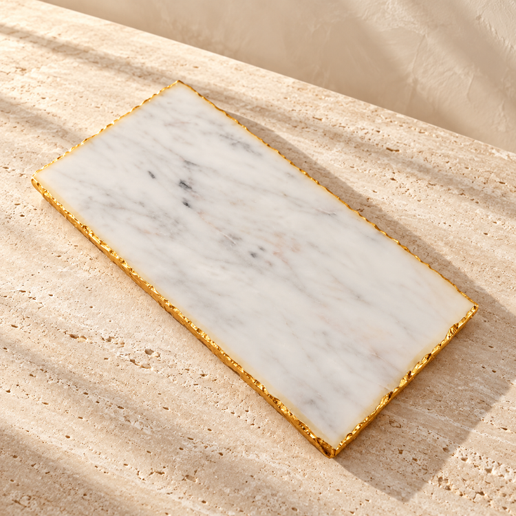 Marble Gold-Edge Serving Board on a sunlit pale travertine counter