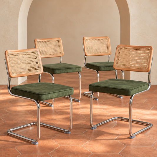 Green Cane-Back Cantilever Dining Chairs, Set of 4 in a cream plaster room with terracotta hexagon flooring