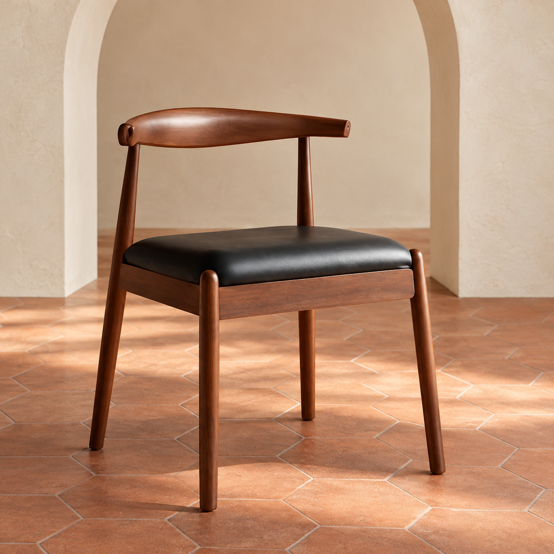 Walnut Finish Horn-Back Dining Chair in a cream plaster room with terracotta hexagon flooring