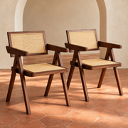 Walnut Rattan Dining Arm Chairs, Set of 2 in a cream plaster room with terracotta hexagon flooring