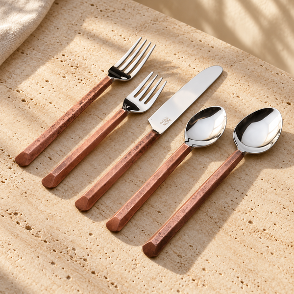 Geometric Handle Stainless Flatware Set on a sunlit pale travertine counter