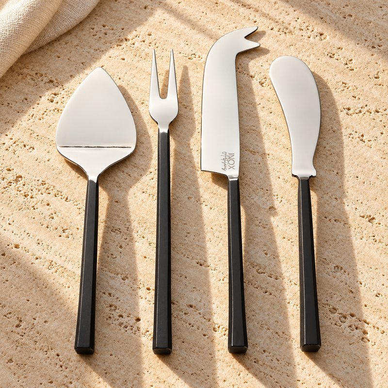 Matte-Handle Steel Cheese Tool Set on a sunlit pale travertine counter