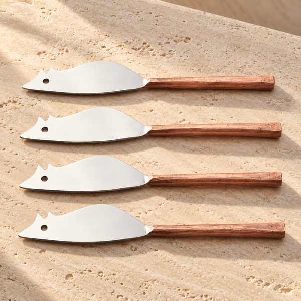 Mouse-Shaped Stainless Steel Cheese Spreader Set on a sunlit pale travertine counter