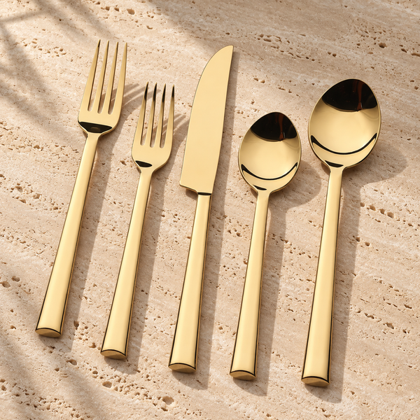 PVD-Coated Stainless Steel Flatware Set on a sunlit pale travertine counter