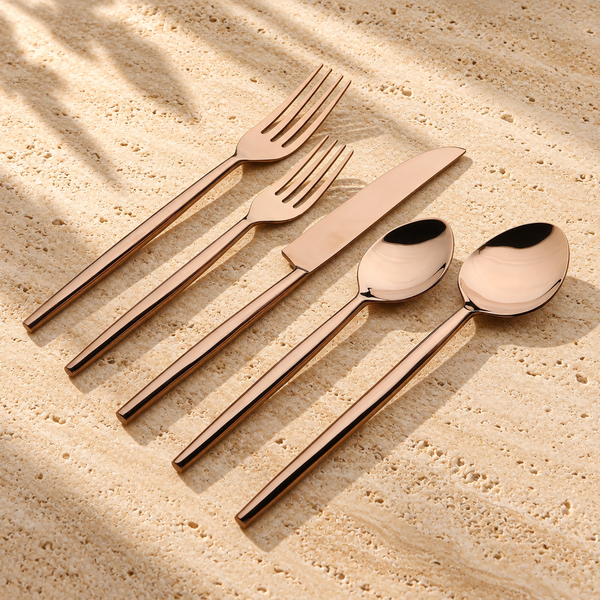 PVD-Coated Stainless Steel Flatware Set on a sunlit pale travertine counter