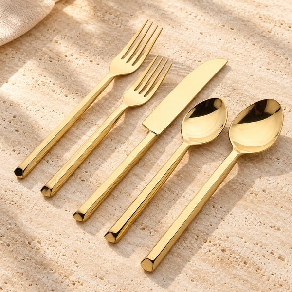 PVD Steel Flatware Set on a sunlit pale travertine counter