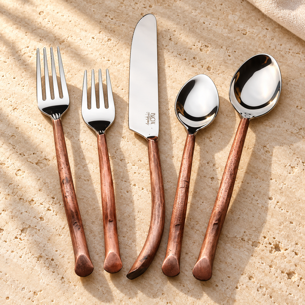 Twig-Handle Stainless Steel Flatware Set on a sunlit pale travertine counter