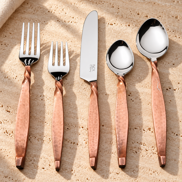 Twisted Handle Stainless Steel Flatware Set on a sunlit pale travertine counter