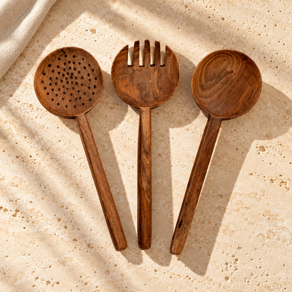 Walnut-Grain Long-Handle Serving Spoon Set on a sunlit pale travertine counter