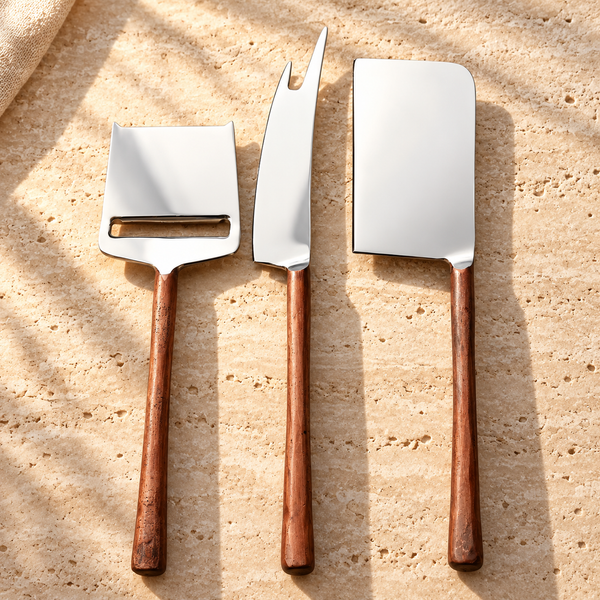 Wood-Handle Cheese Knife Set on a sunlit pale travertine counter