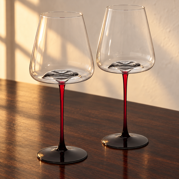 Large Concave Wine Glasses - 16oz empty on an espresso walnut bar top in warm side light
