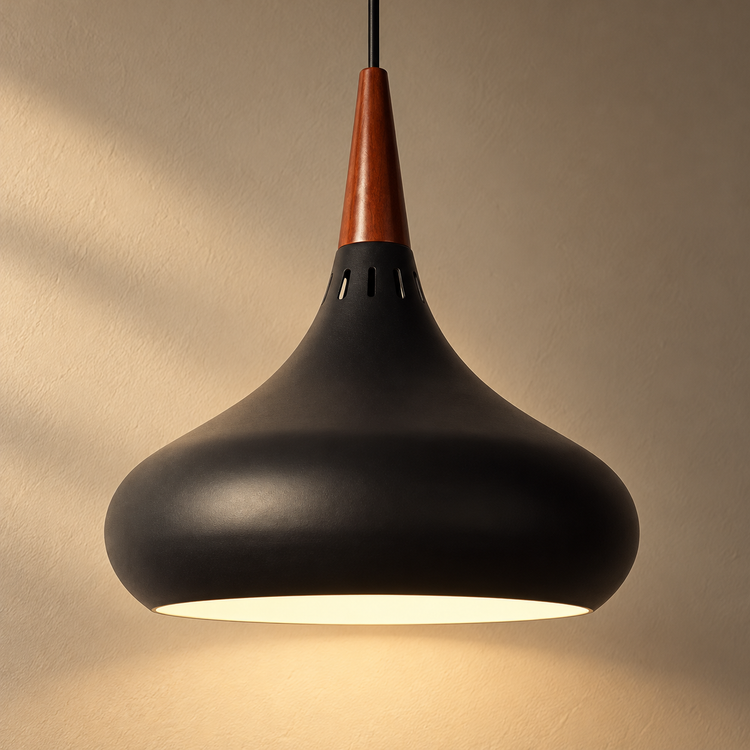 Teardrop LED Pendant Light illuminated against cream plaster