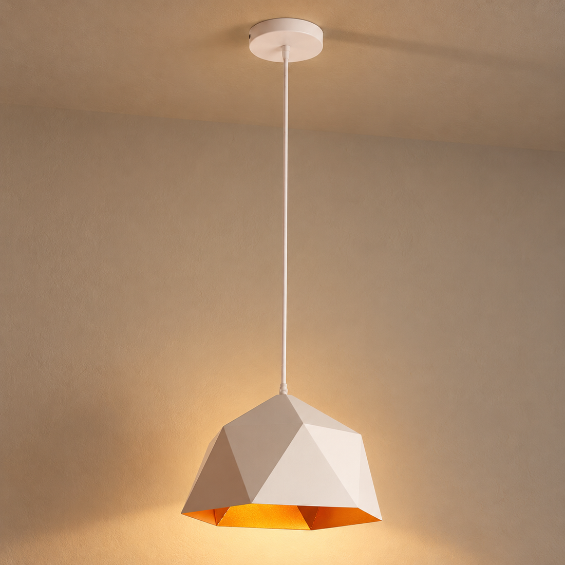 Geometric Faceted Iron Pendant Light illuminated against cream plaster