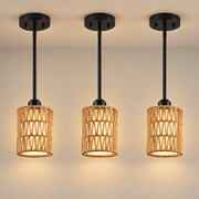 Rattan Linen Pendant Ceiling Light illuminated against cream plaster