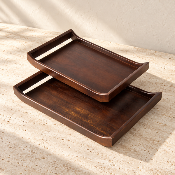 Acacia Wood Serving Tray Set on a sunlit pale travertine counter