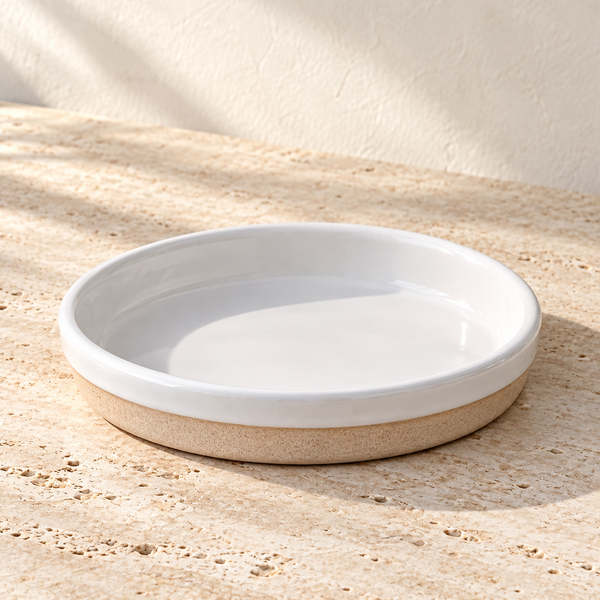Glazed Ceramic Snack Plate on a sunlit pale travertine counter