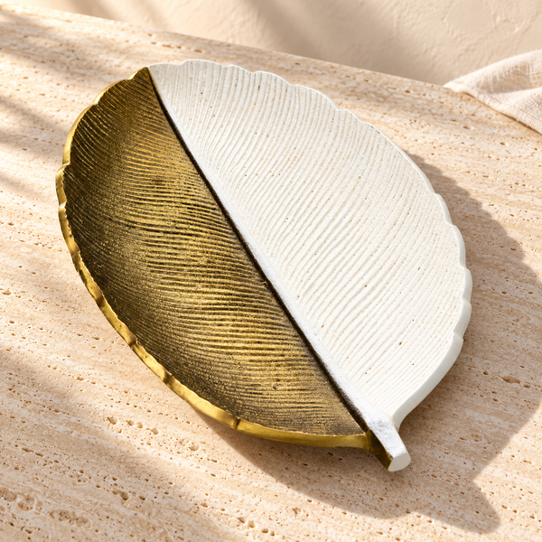 Gold and White Leaf Decorative Tray on a sunlit pale travertine counter