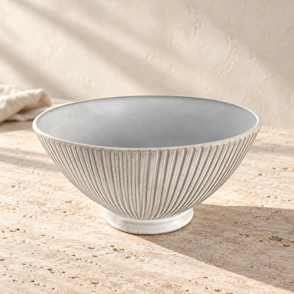 Hand-Carved Matte Ceramic Serving Bowl on a sunlit pale travertine counter