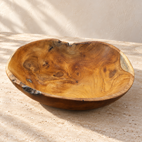 Live Edge Hand-Carved Teak Bowl on a sunlit pale travertine counter