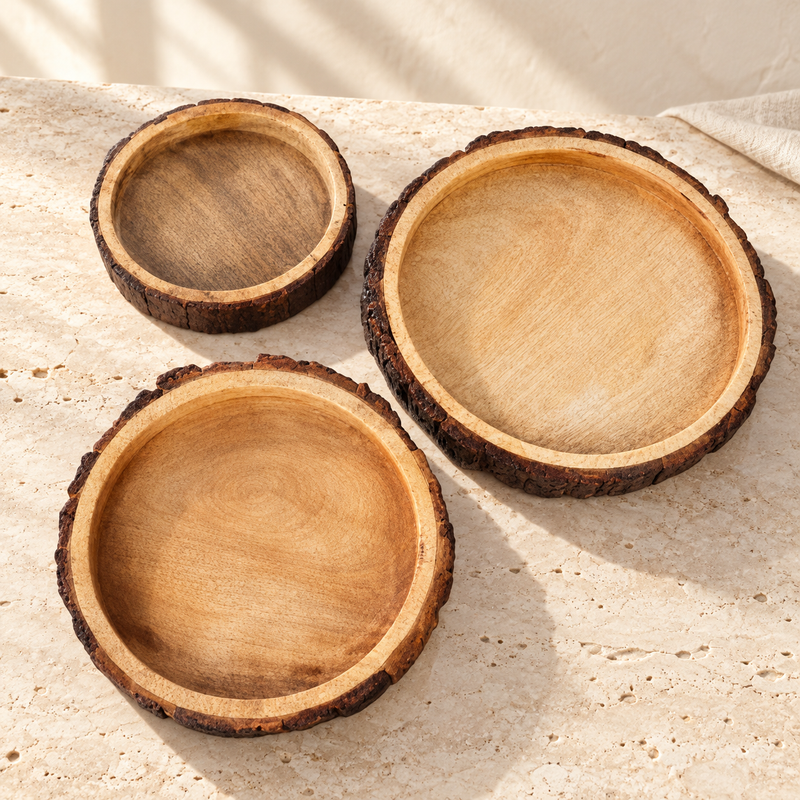 Live-Edge Mango Wood Bark Bowl Set on a sunlit pale travertine counter