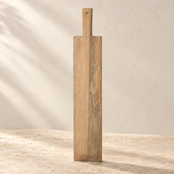 Mango Wood Oblong Serving Board on a sunlit pale travertine counter