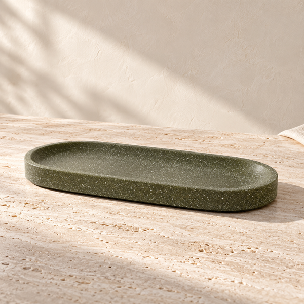Micro Terrazzo Concrete Oval Platter on a sunlit pale travertine counter