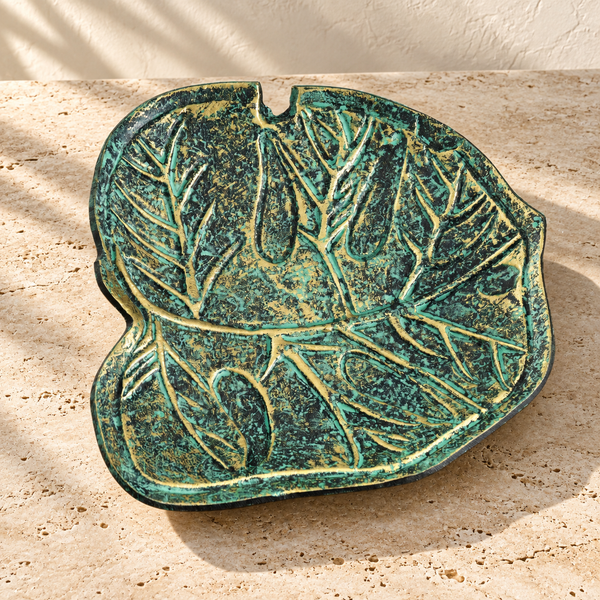 Patinated Leaf-Form Decorative Dish on a sunlit pale travertine counter