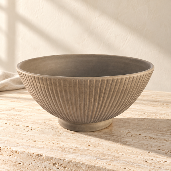 Ridged Ceramic Large Serving Bowl on a sunlit pale travertine counter