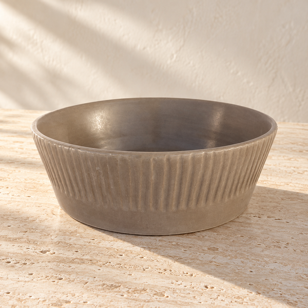 Ridged Stoneware Oversized Serving Bowl on a sunlit pale travertine counter
