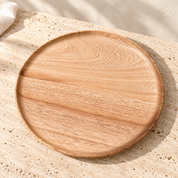 Rosa Morada Round Wood Platter on a sunlit pale travertine counter