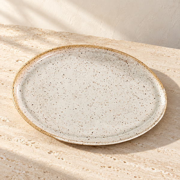 Speckled Stoneware Snack Tray on a sunlit pale travertine counter