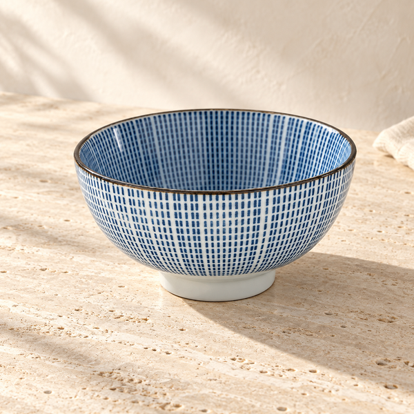 Under-Glaze Porcelain Serving Bowl on a sunlit pale travertine counter
