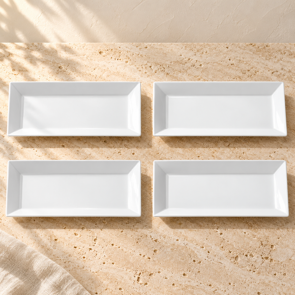 White Porcelain Rectangular Serving Platters Set on a sunlit pale travertine counter