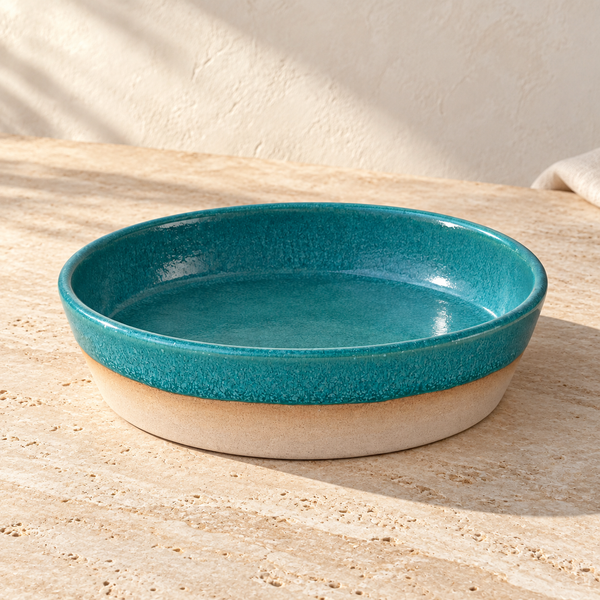 Wide Glazed Ceramic Share Bowl on a sunlit pale travertine counter