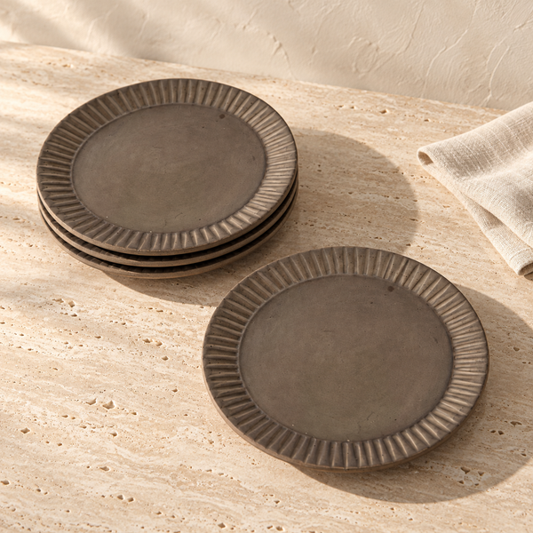 Hand-Carved Stoneware Salad Plate Set on a sunlit travertine counter