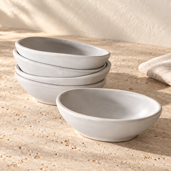 Cloud Glaze Oval Ceramic Bowl Set on a sunlit travertine counter