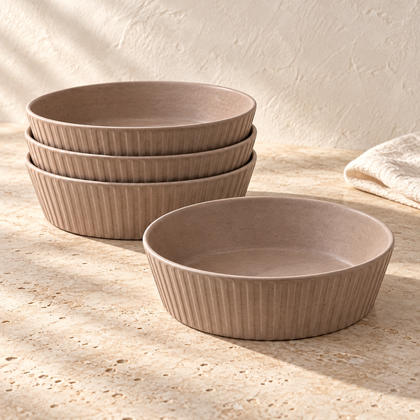 Ridged Stoneware Pasta Bowl Set on a sunlit travertine counter