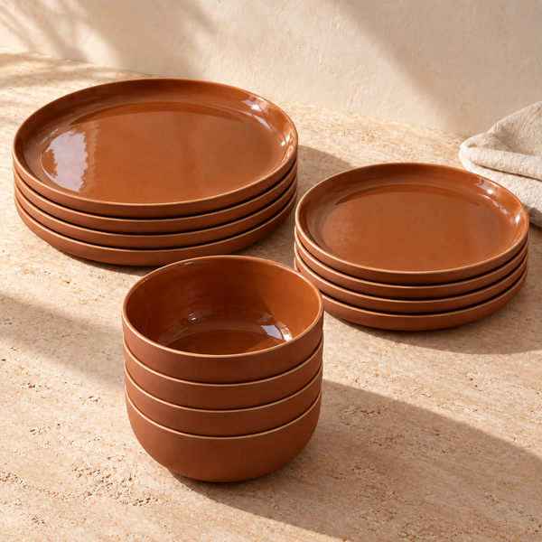 Tunisian Glazed Stoneware Dinnerware Set on a sunlit travertine counter