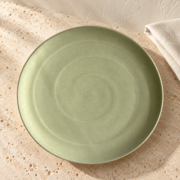 Handcrafted Moss Clay Dinnerware Plate in Dinner Plate on a sunlit travertine counter